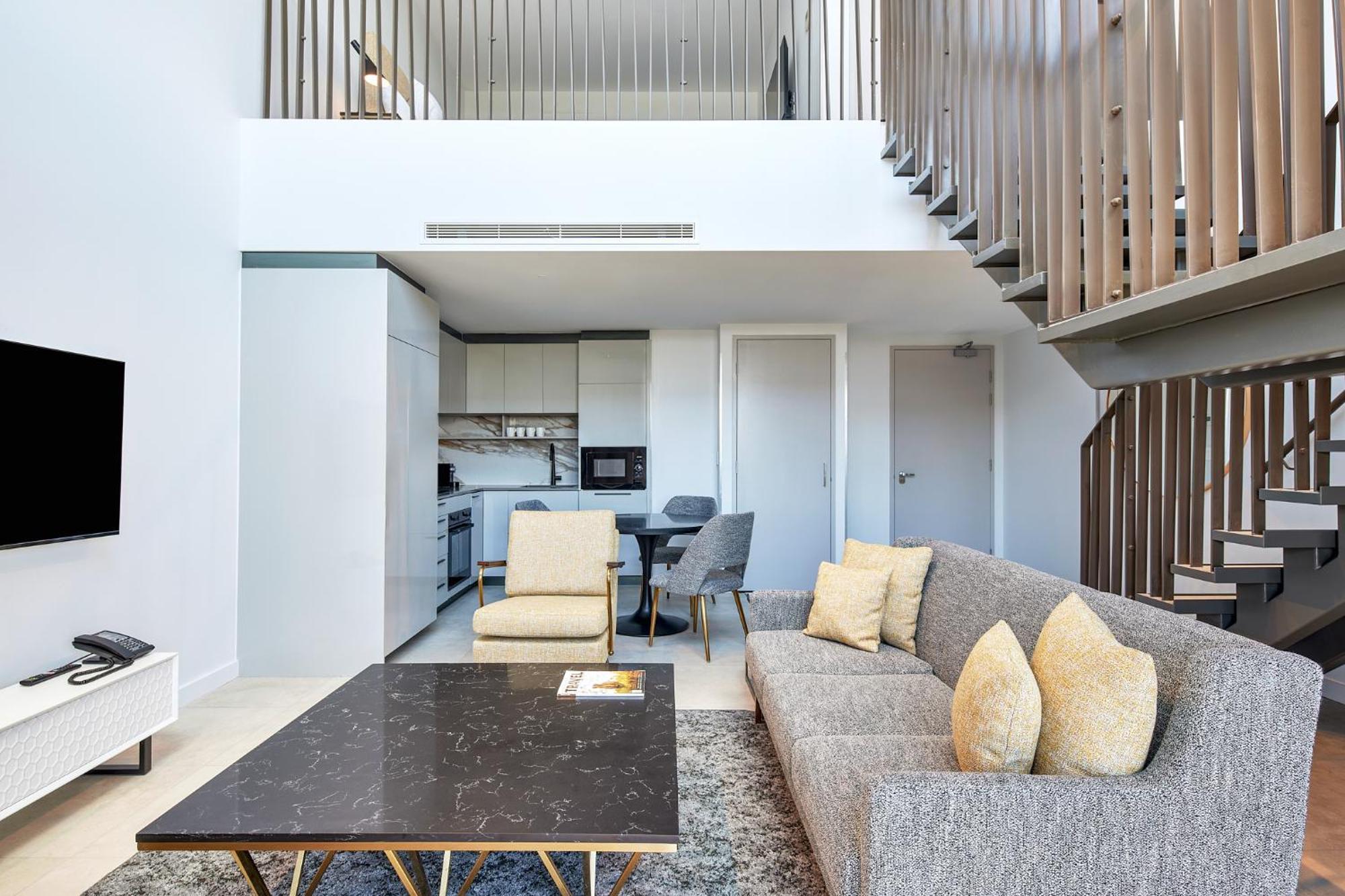 Meriton Suites Canberra Kültér fotó The interior of a duplex apartment